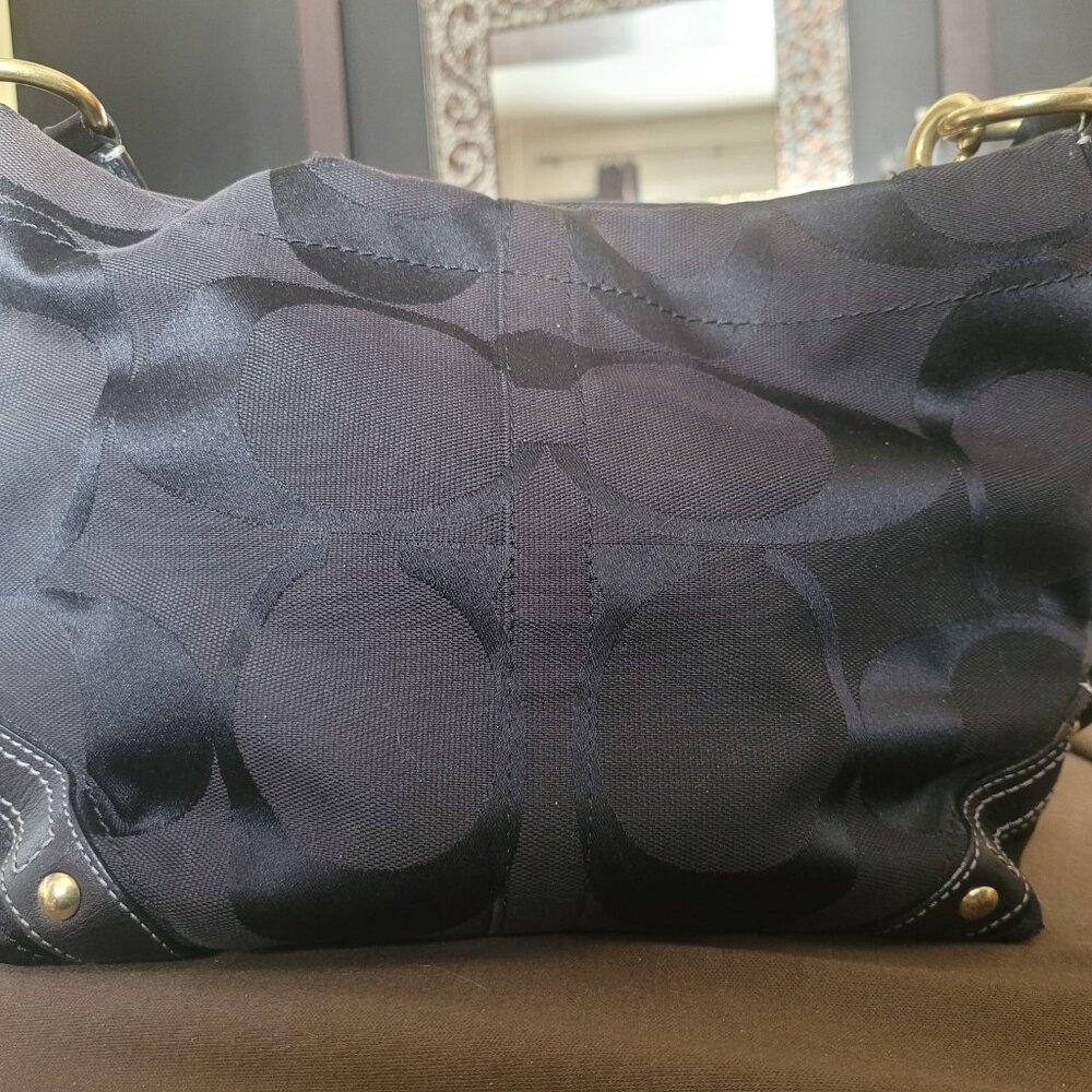 Coach “Carly” hobo bag, black on black with brass accents